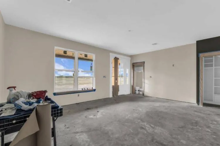 Main-level primary bedroom with large windows
