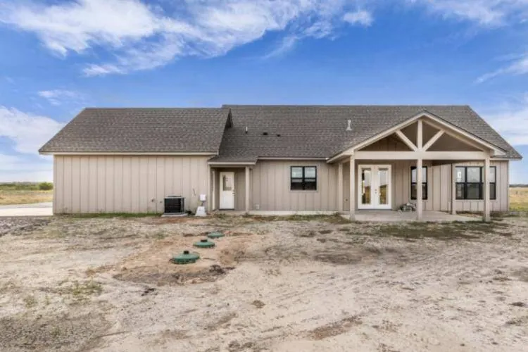 Rear of the home with the covered patio